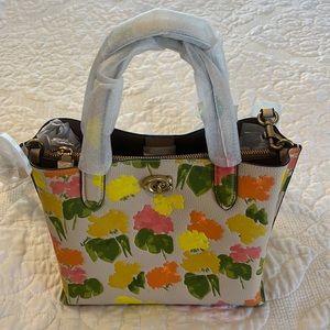 New Coach floral print purse.